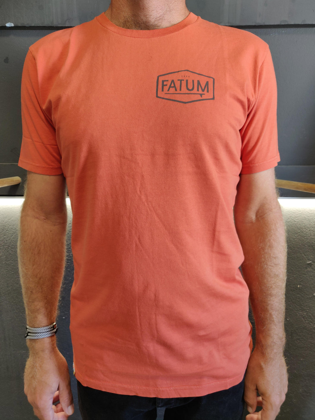 Fatum CHest Print Tee in Orange. Model is wearing an L and is 186cm and 86kg.