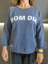 Load image into Gallery viewer, Fatum Bom Dia Sweat in Blue. Model is wearing an S and is 164cm tall and 50kgs.